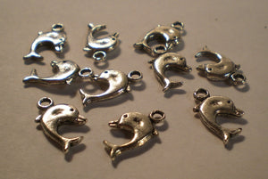 Small silver dolphin charms, 16mm.